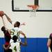 Huron sophomore Brian Walker attempts to block a Pickney shot on Monday, March 4. Daniel Brenner I AnnArbor.com